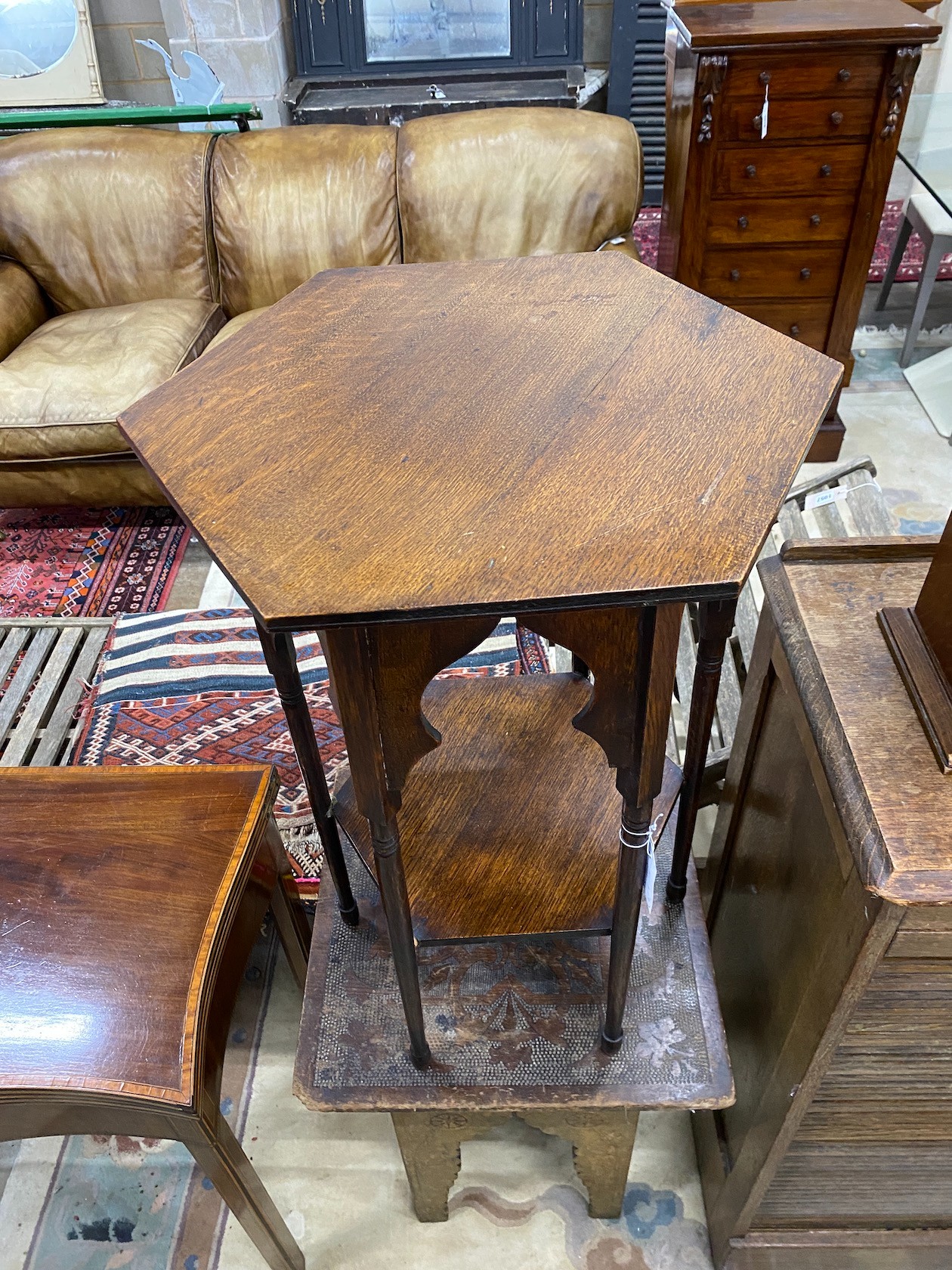 A Liberty style octagonal oak centre table, width 45cm, height 70cm together with a Moorish pokerwork table